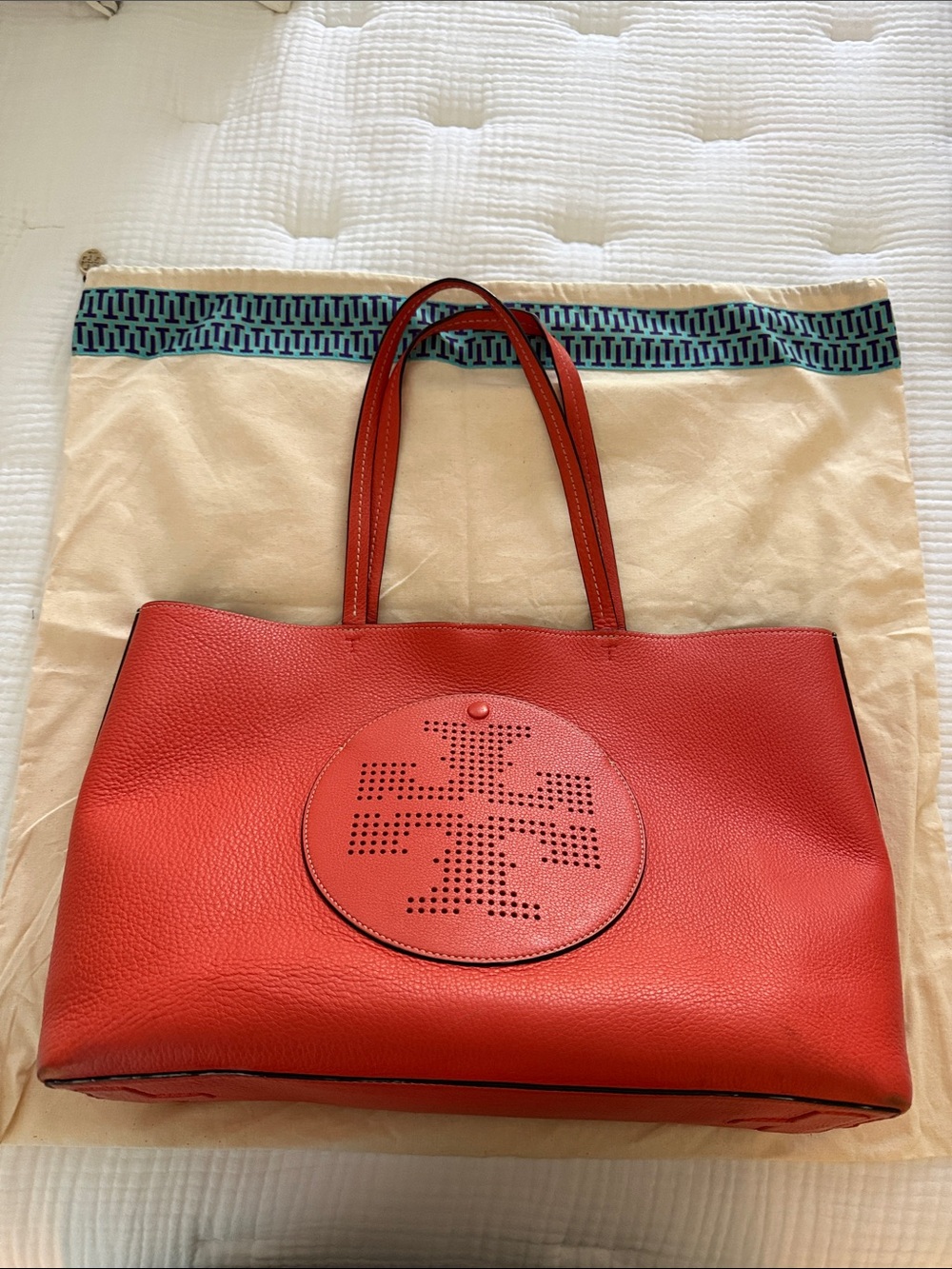Tory Burch orange Perforated Logo Pebble Leather Tote